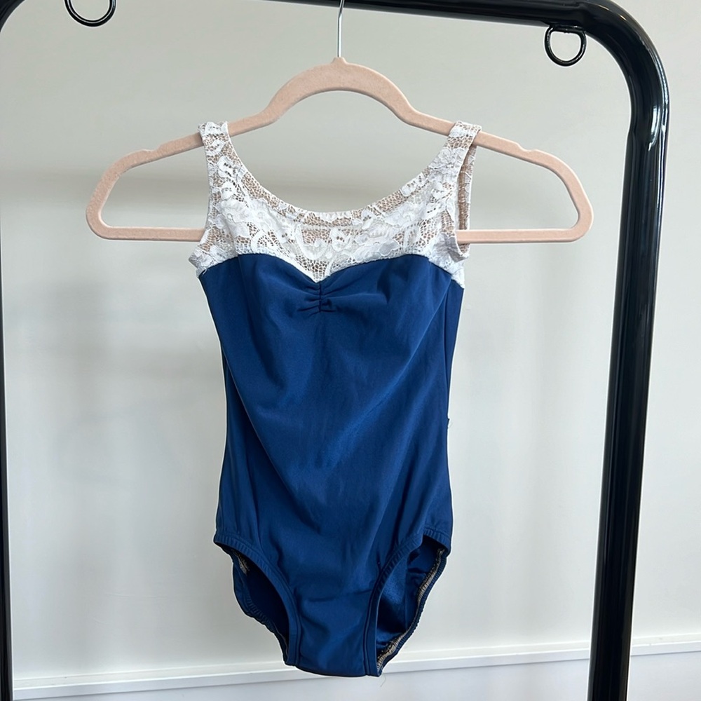 Lucky Leo women’s size S leotard. Blue w/ white lace.